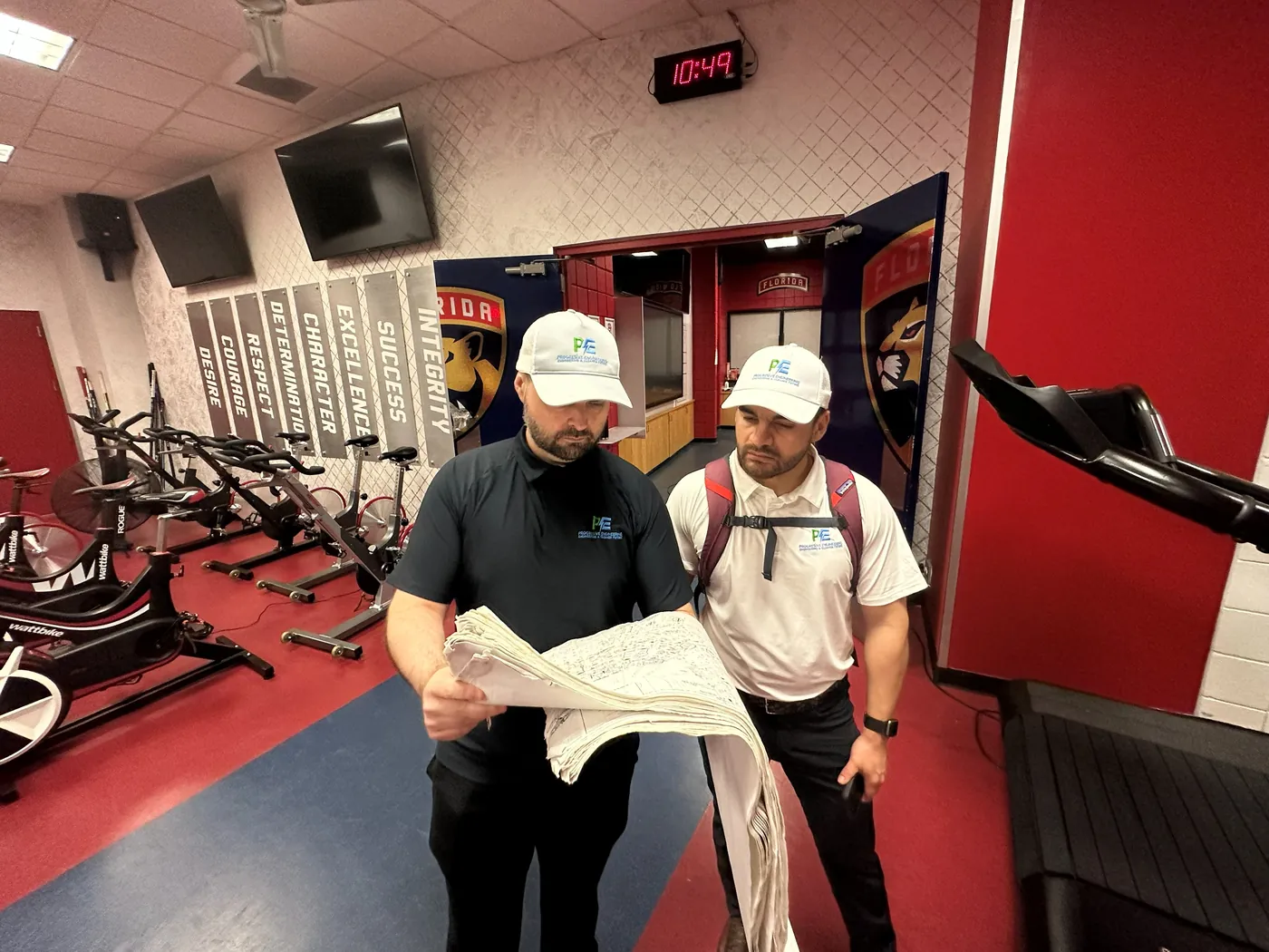 Progresíve engineers reviewing record drawings during the arena field survey