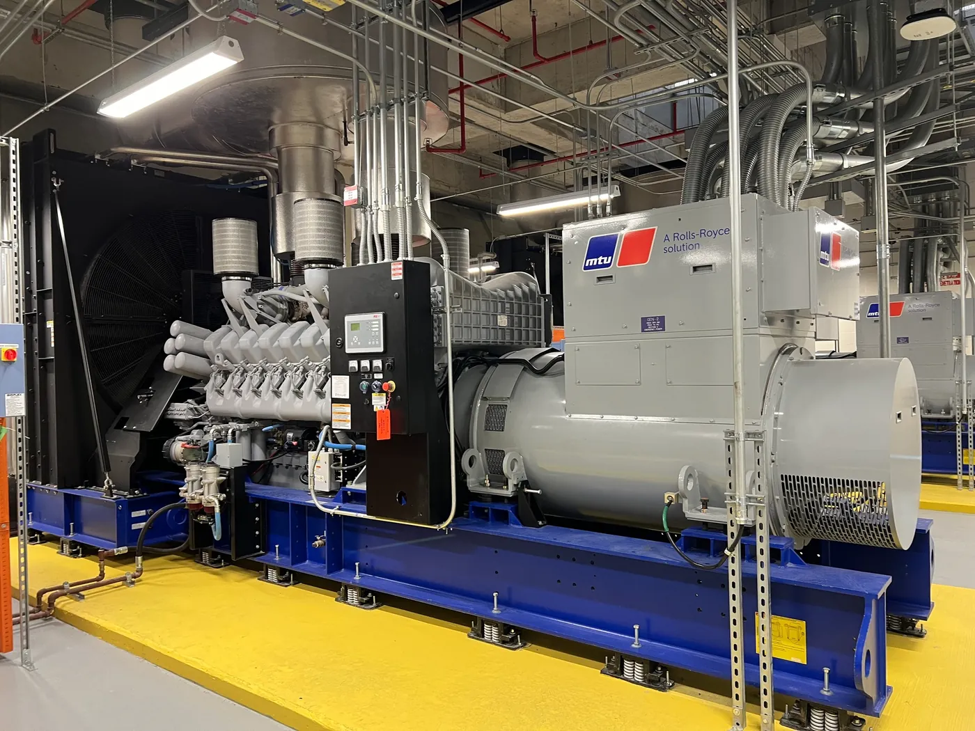 Large standby generator inside a hospital energy plant