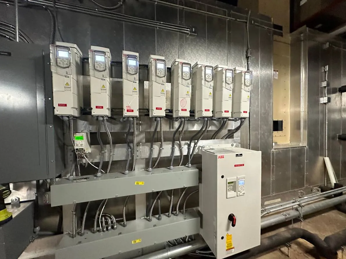 Variable frequency drives serving building fans